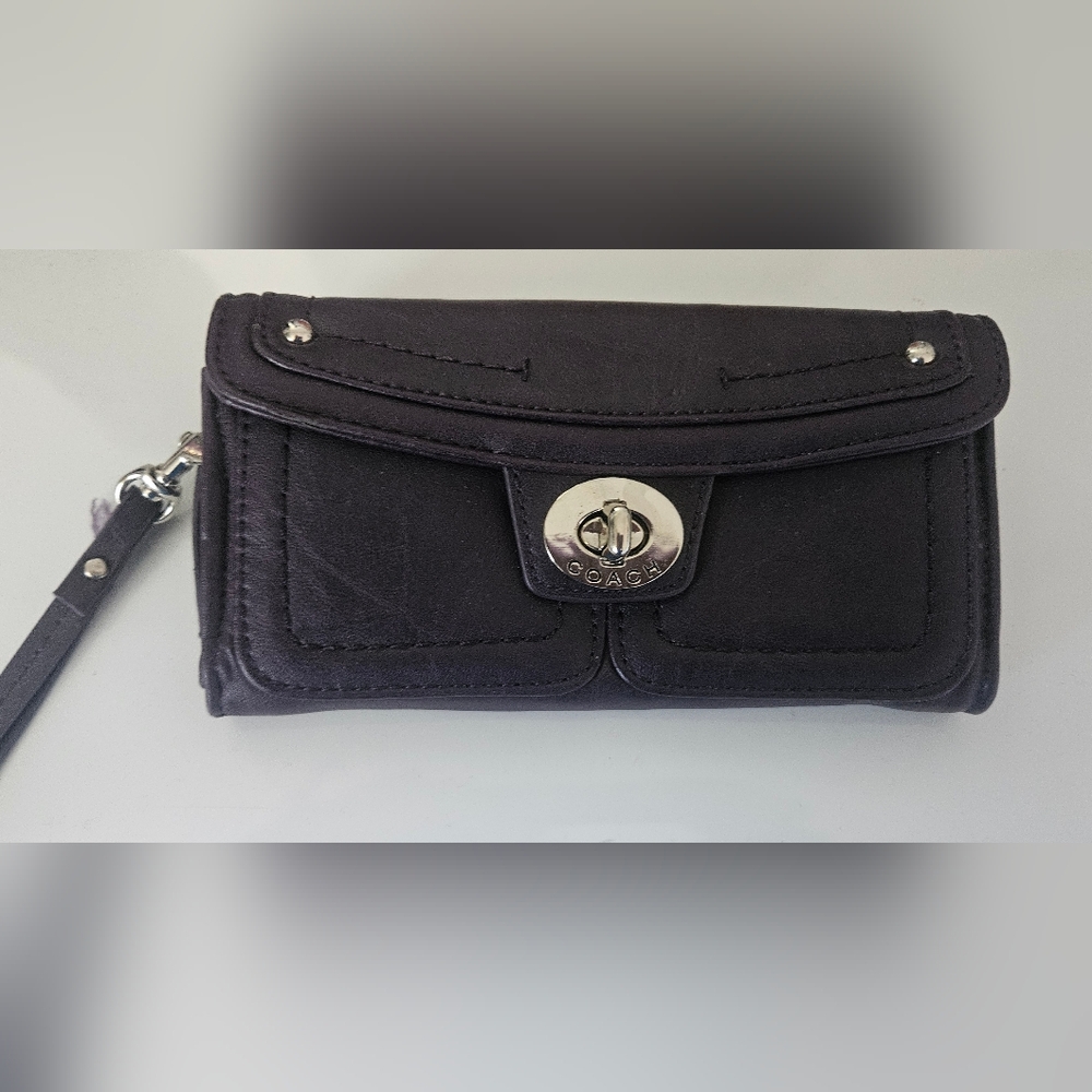 Coach pocketbook/wallet color dark purple . Never Been Used
